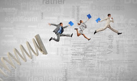 Business people jumping on springboard as progress concept